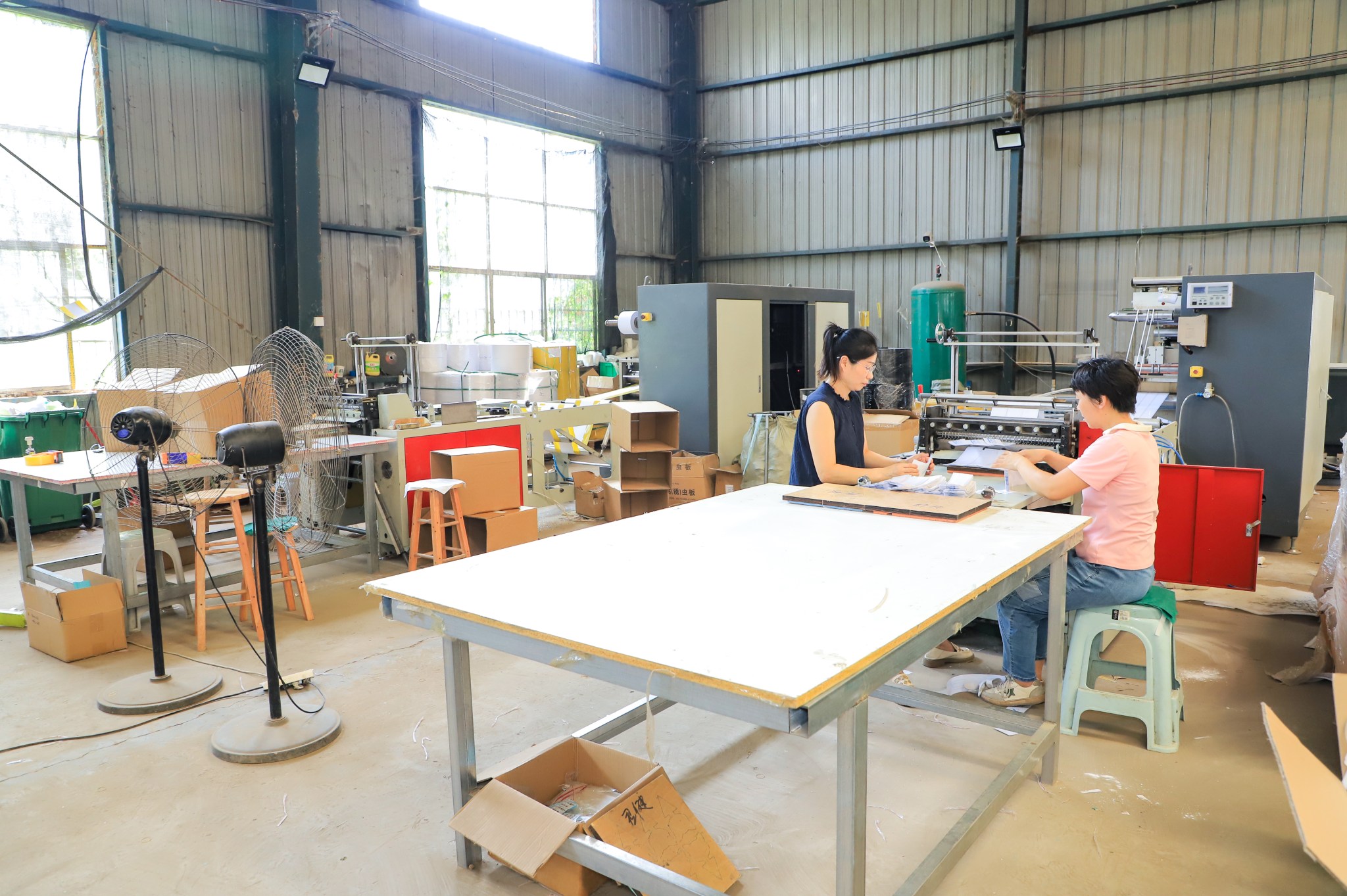 Glue boards counted and packed at the bench on our factory floor