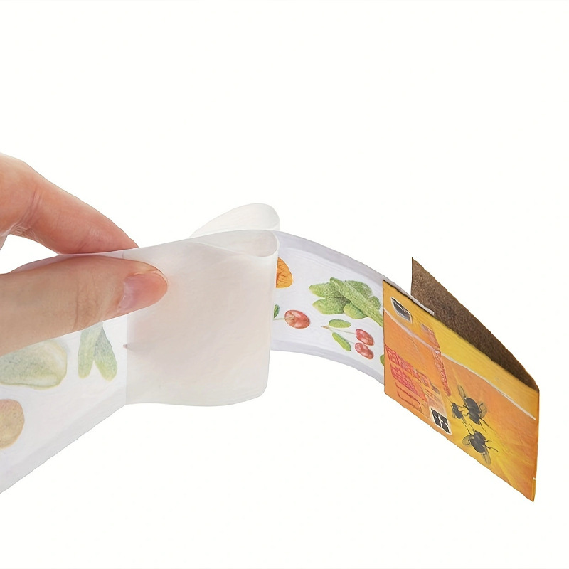 Fruit Fly Traps Catcher Solid Sticky Fly Paper Trap Eco-friendly Disposable Indoors Outdoors Flying Insects Moths Mosqui 1 Person is peeling a thin, curved card from a roll of fruit-themed, printed cards in a strip shape.