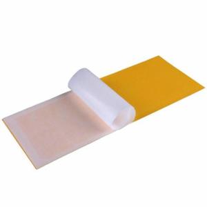 Yellow replacement glue board for UV insect light trap with silicone release liner being peeled off
